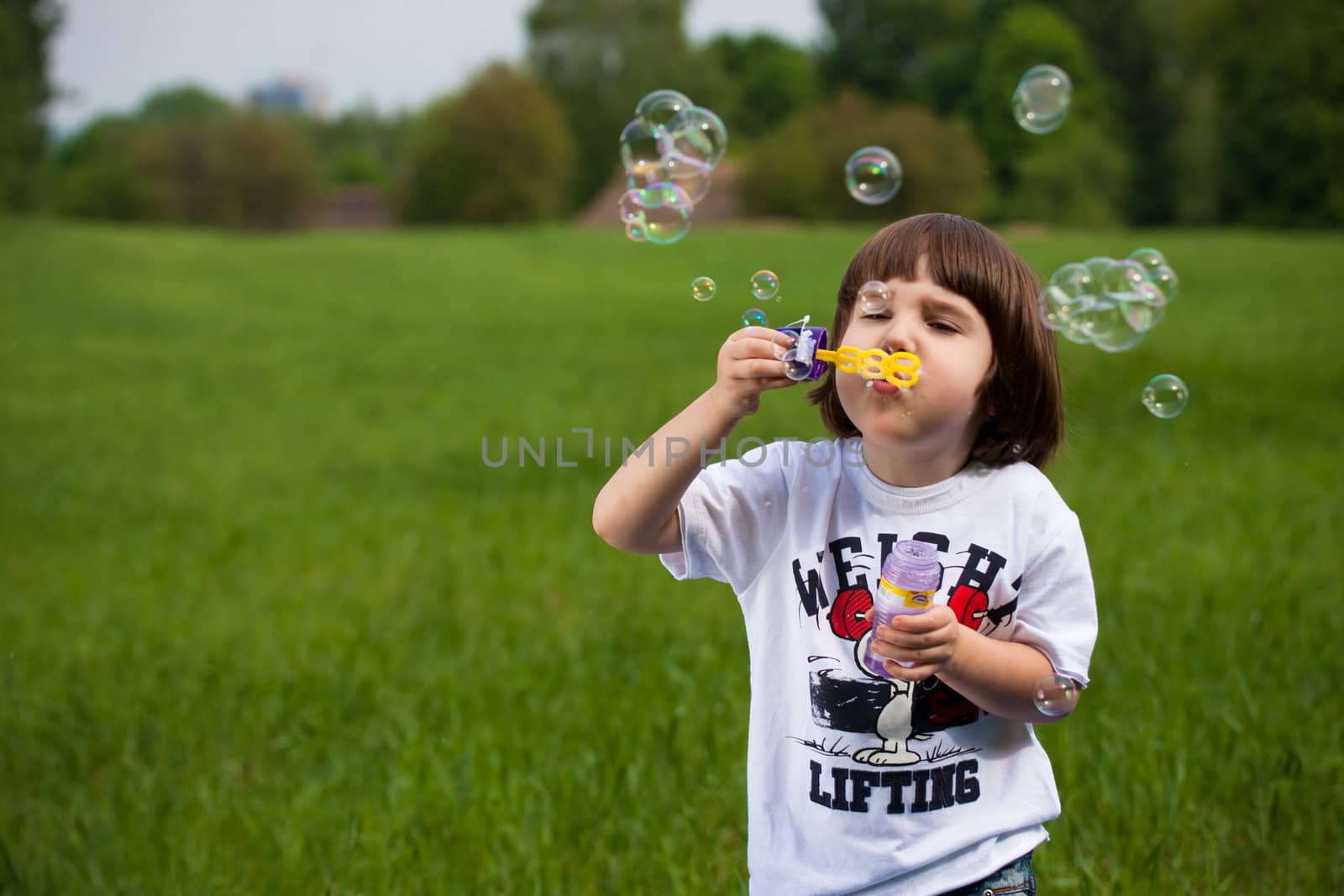 Boy and many soap-bubbles
