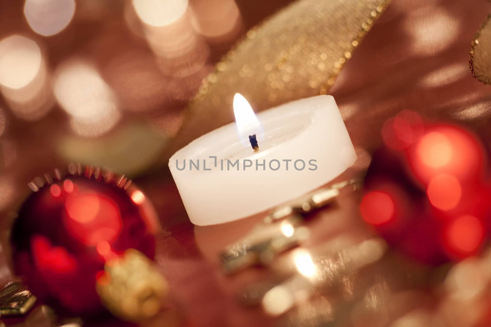 Christmas decoration with tealight. Selective focus, aRGB.