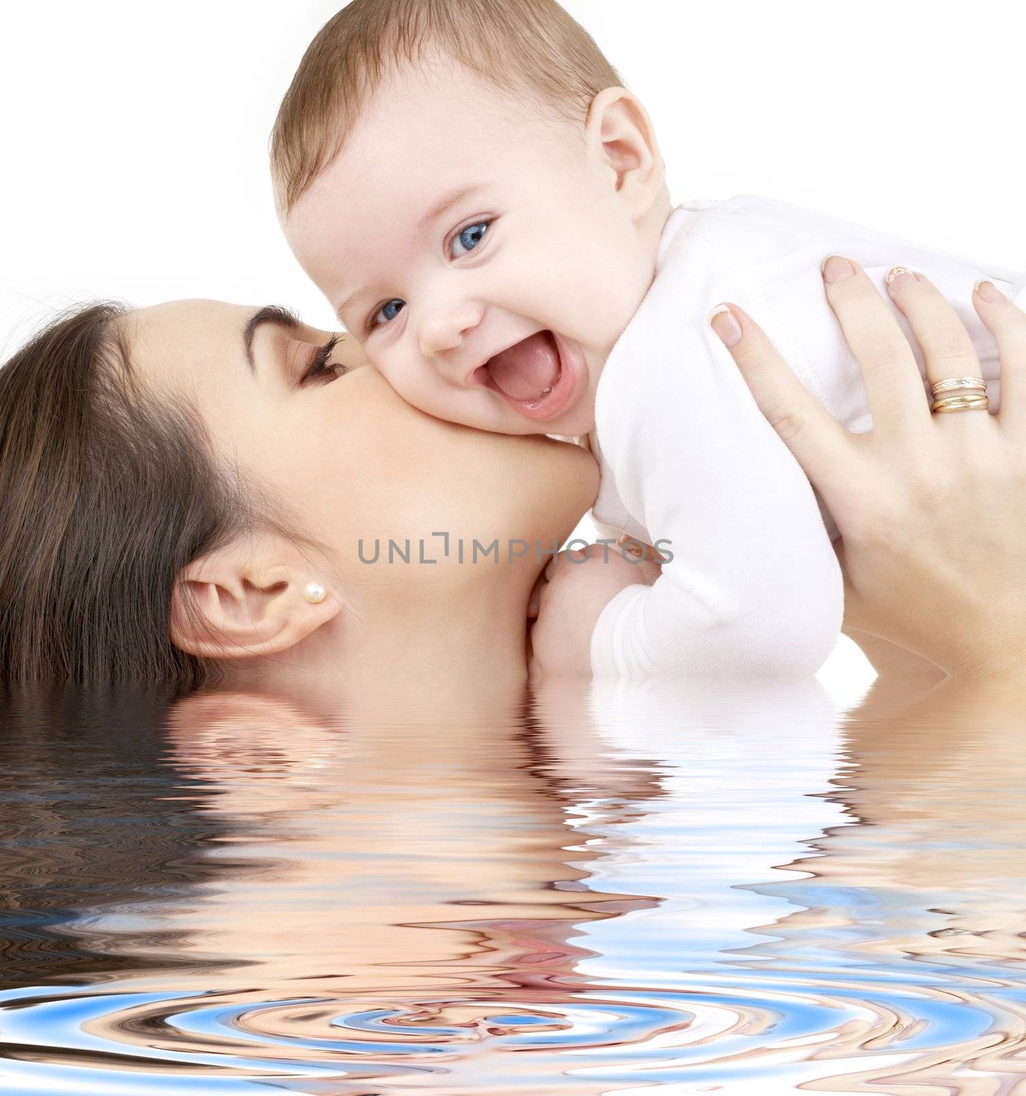 laughing baby playing with mother in water by dolgachov