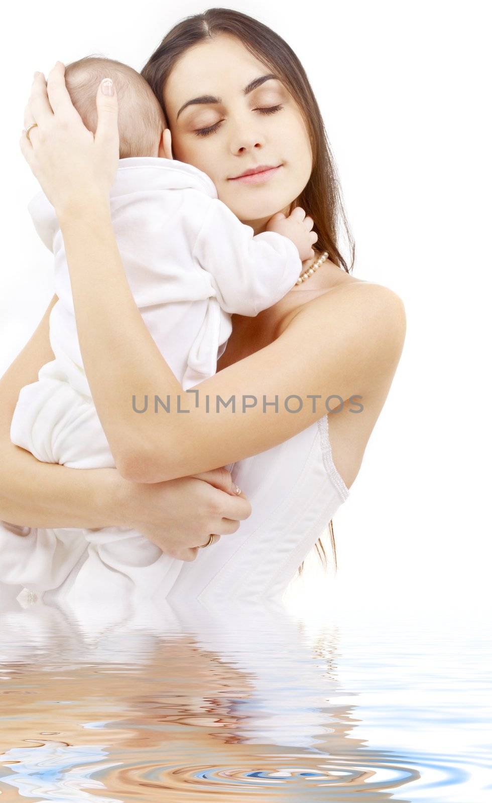 picture of happy mother with baby boy in water