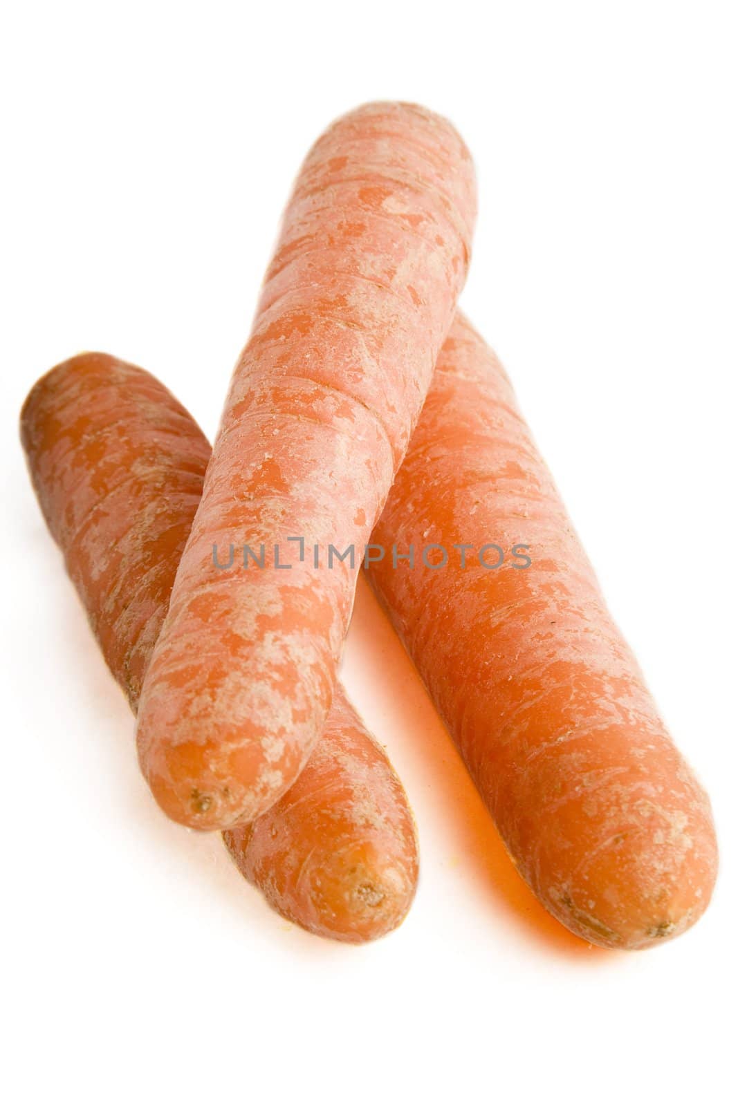 Three carrots on a white background.