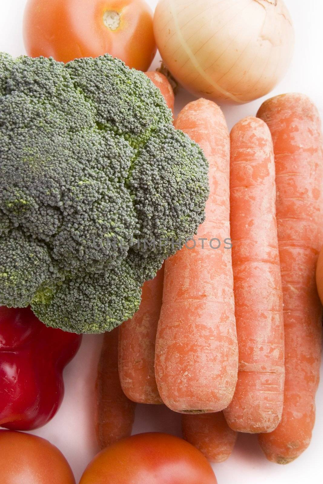 Group of raw vegetables on a white background