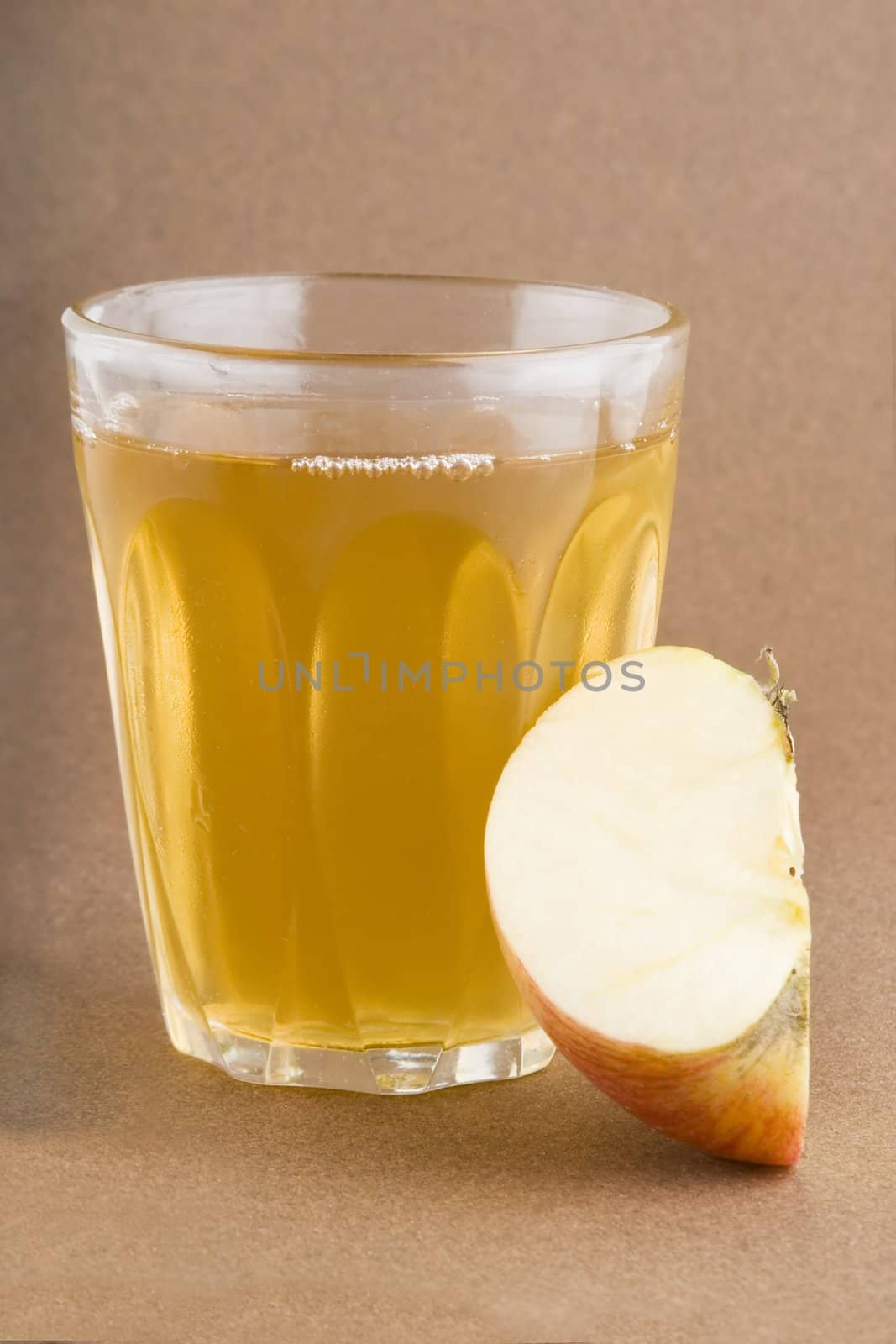 Fresh apple juice on a dark background.