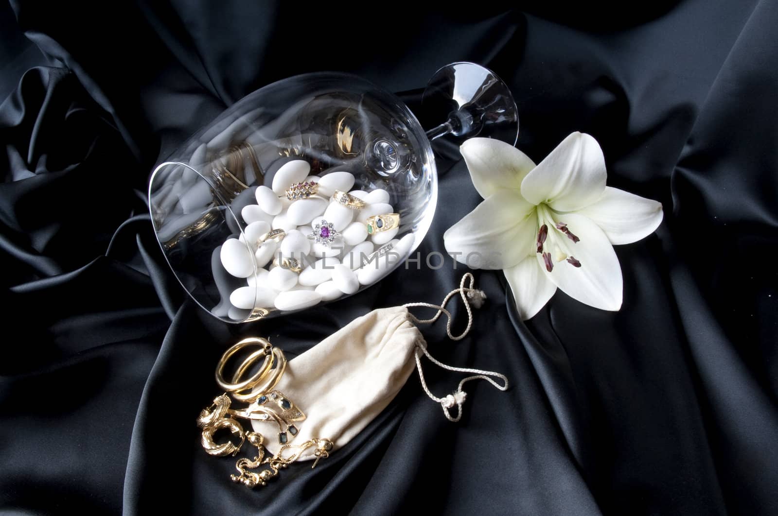 Jewelry and other precious stones on black background fabric
