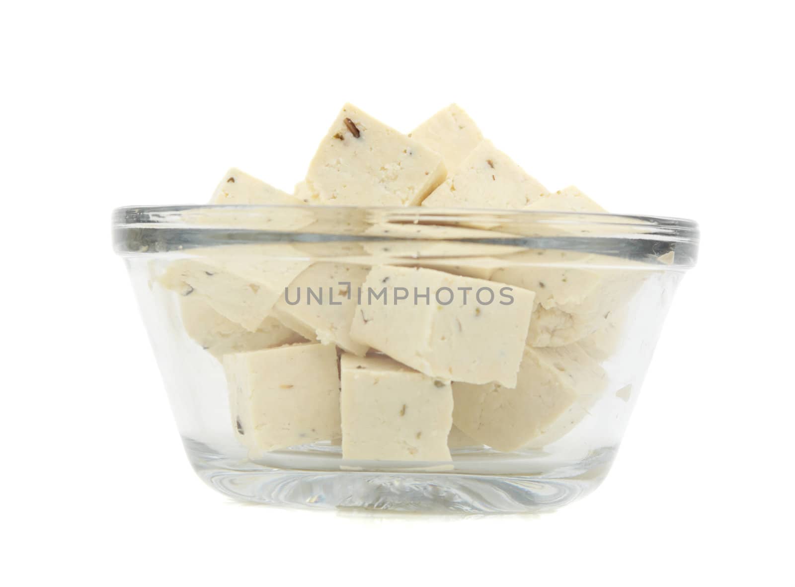 cube of fresh fine herbs tofu in a bowl, isolated on white