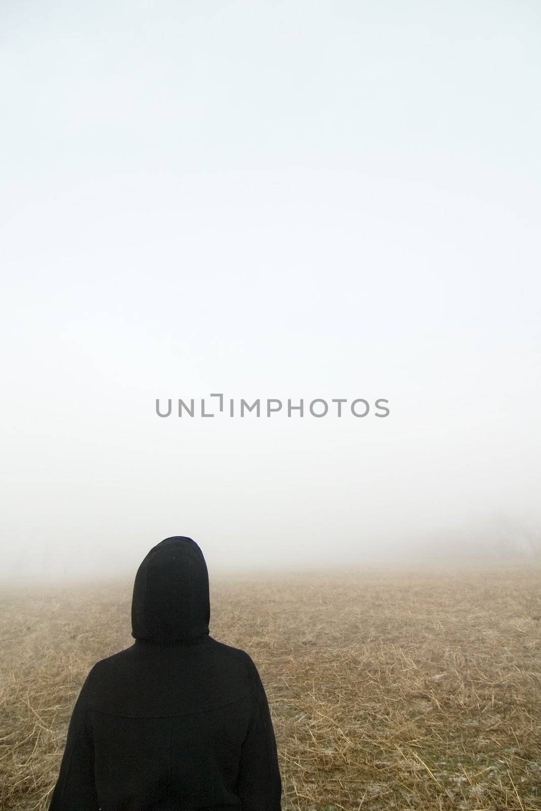 Walking alone on a foggy day