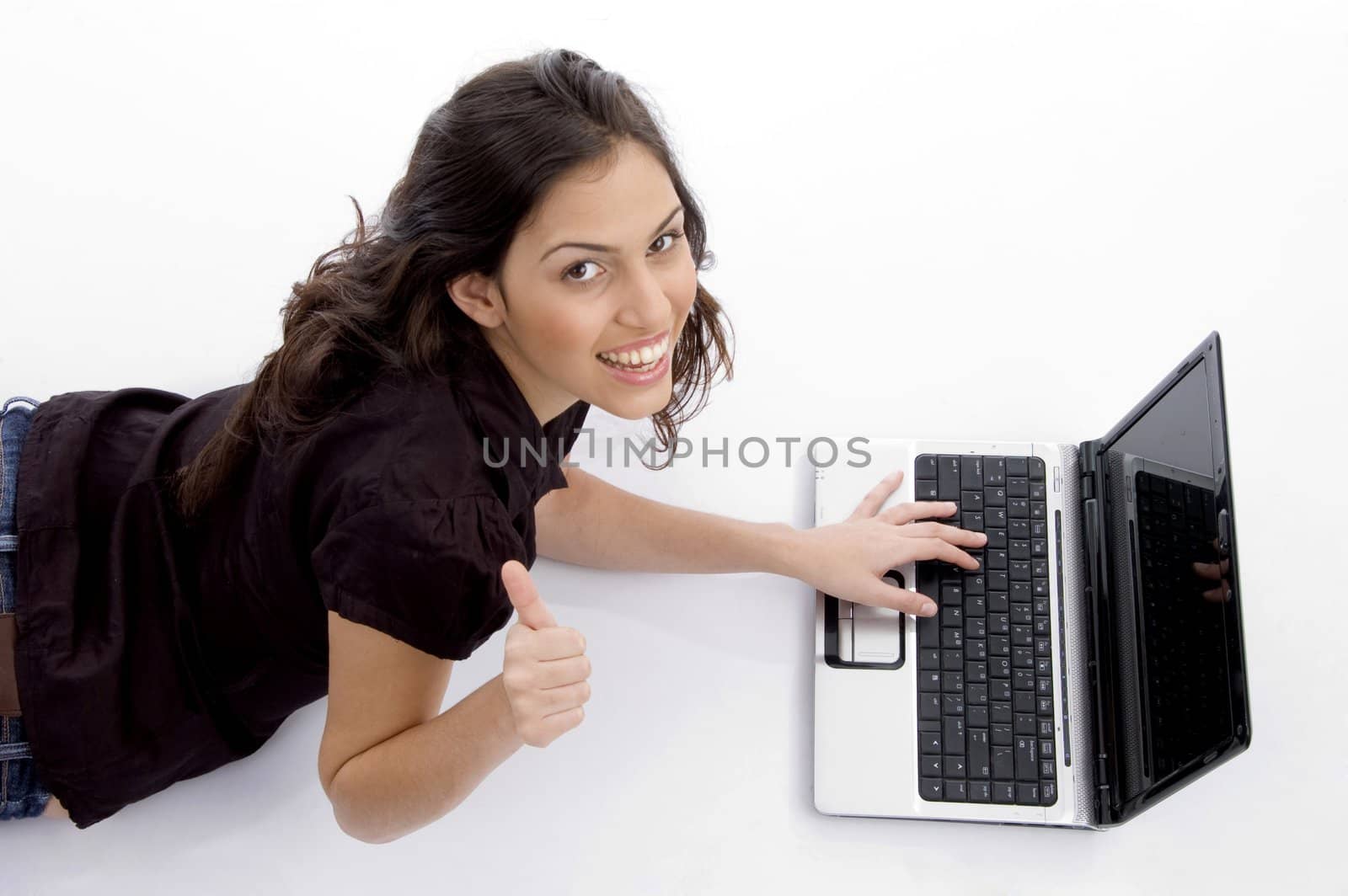 laying woman with laptop and looking upward with white background