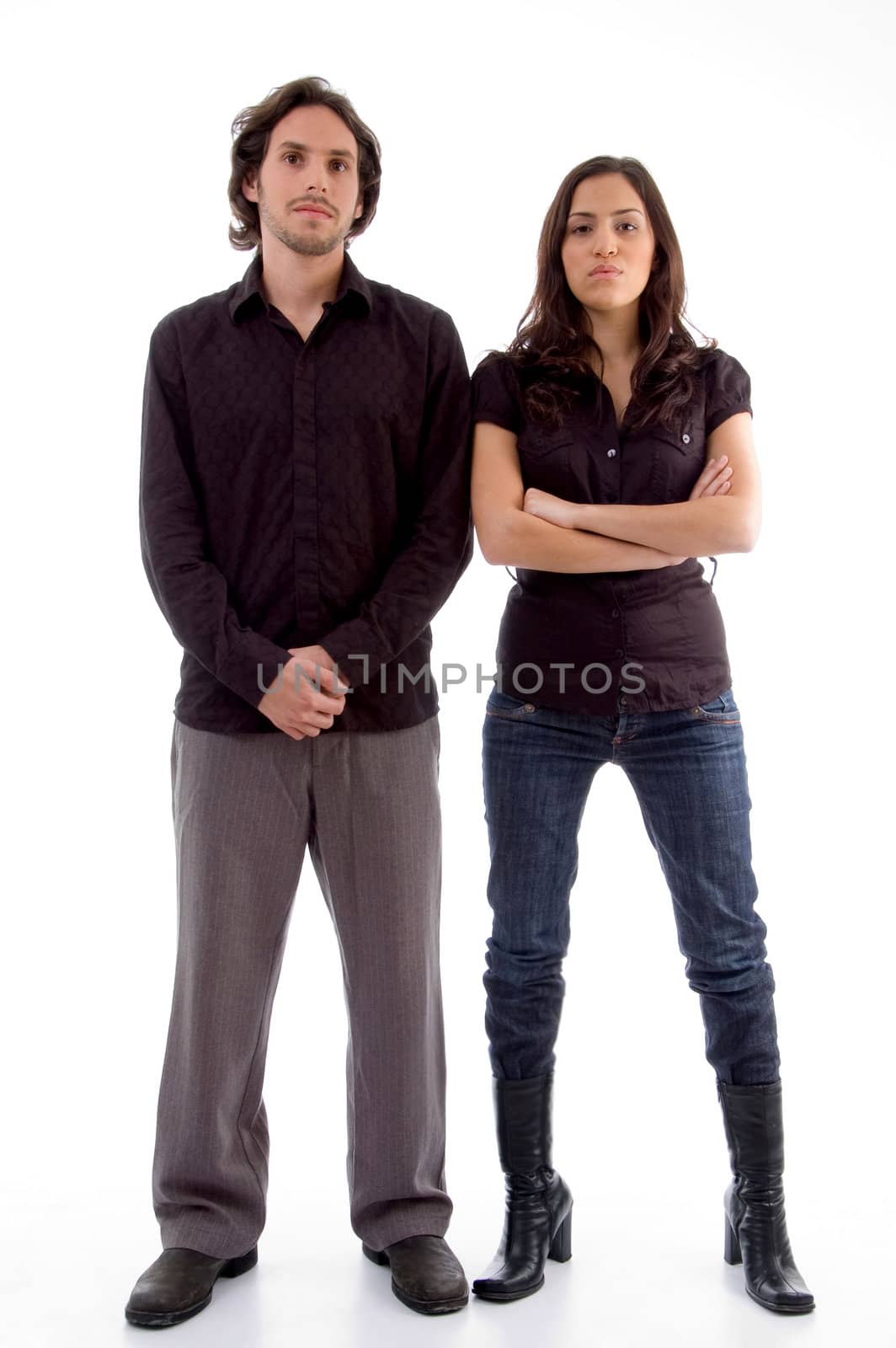 standing couple looking at camera on an isolated white background