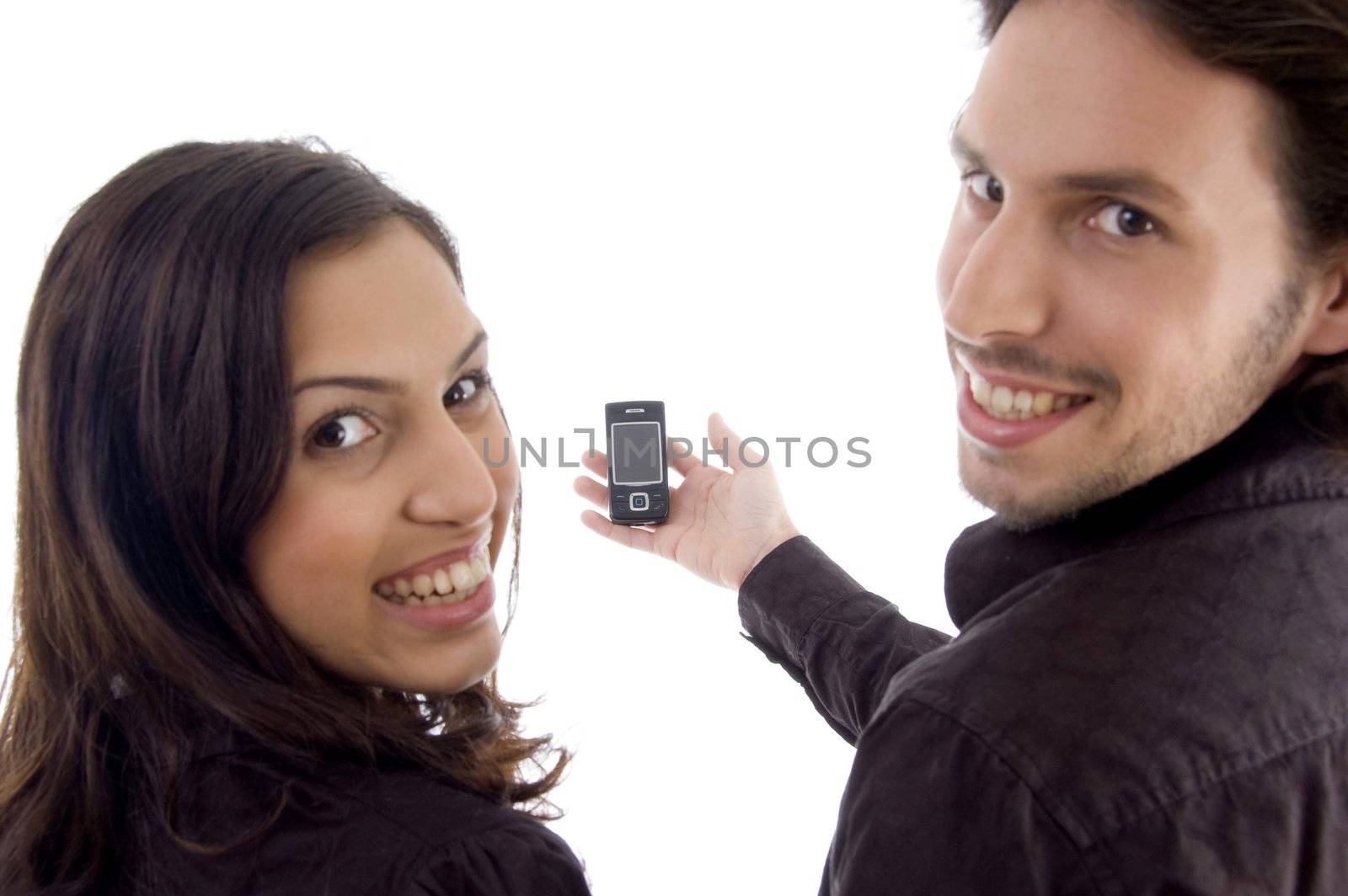 pleased friends showing cell phone on an isolated background