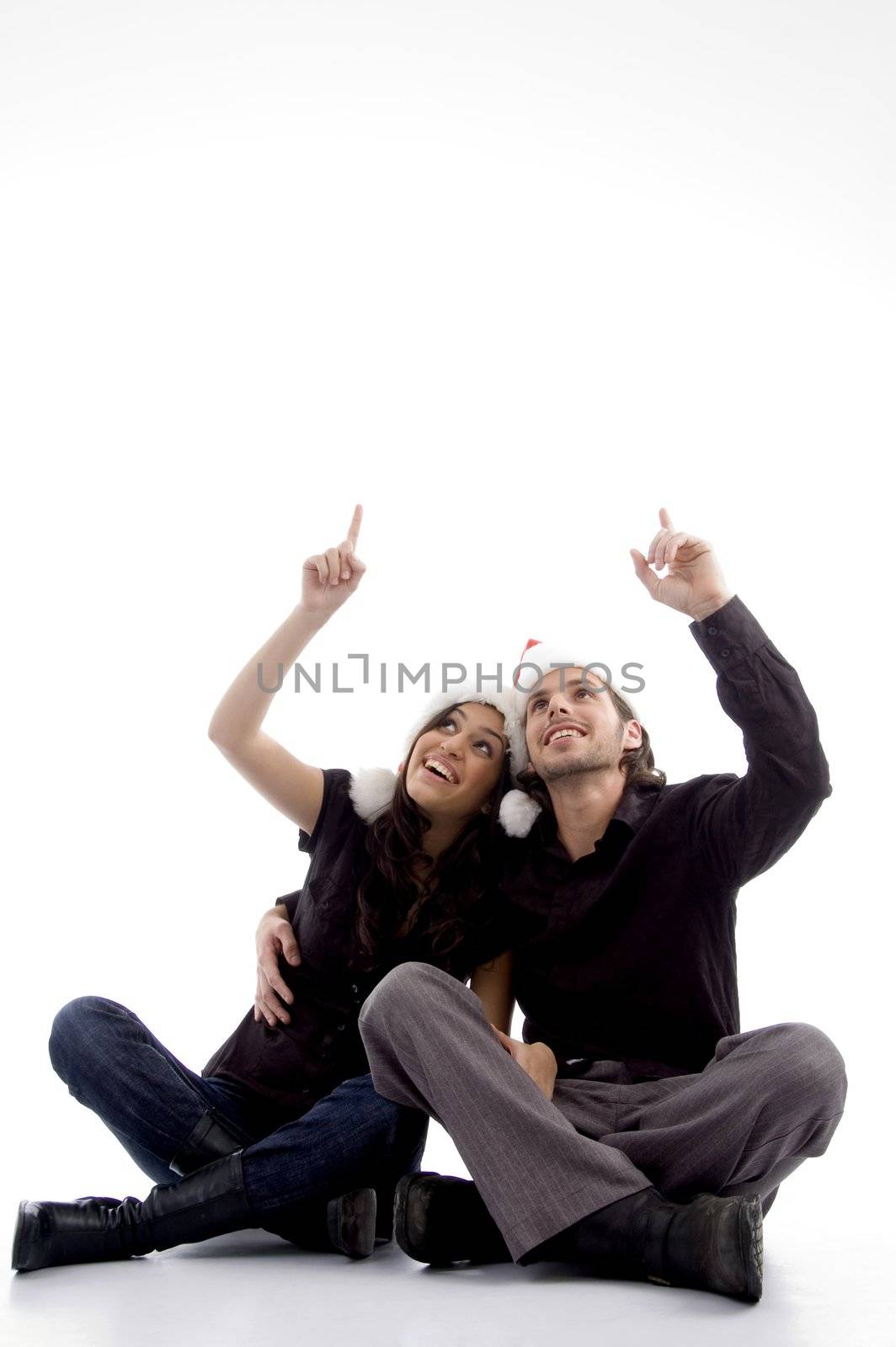 young couple wearing christmas hat with hand gesture on an isolated white background