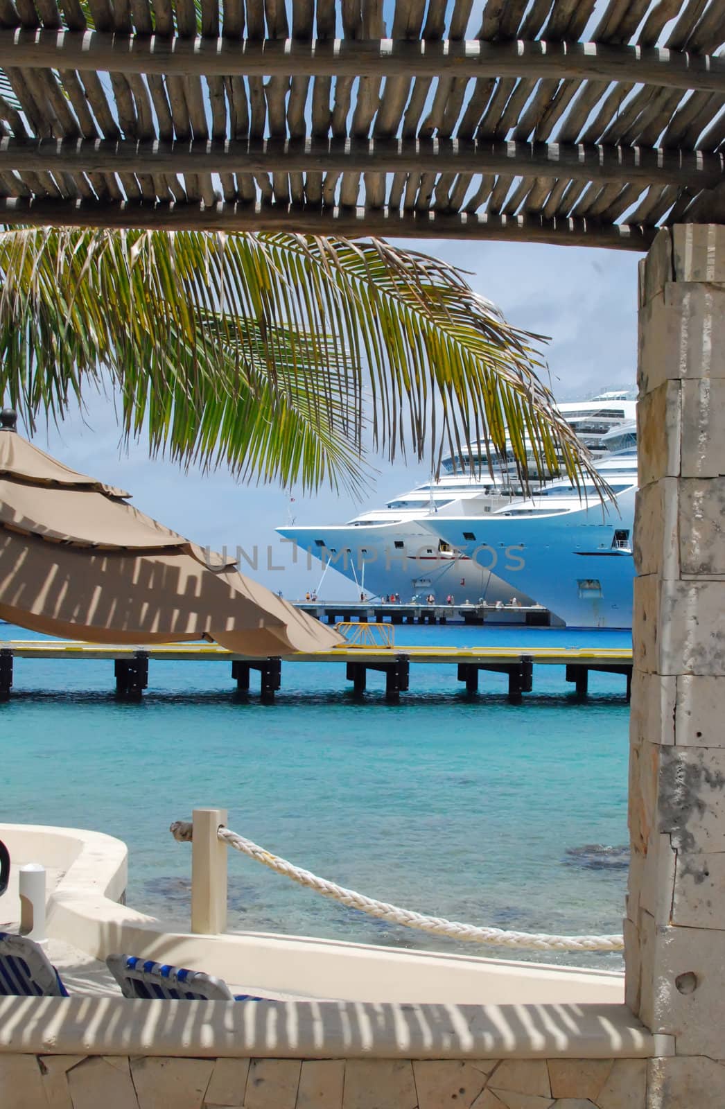 Cruise ships in port at cozumel,mexico viewed from an outdoor cafe in the port shopping plaza.