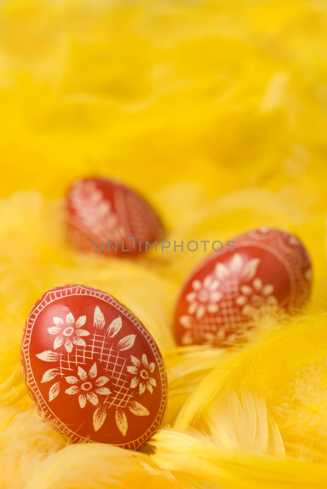 Three handmade easter eggs - selective focus on the first one.