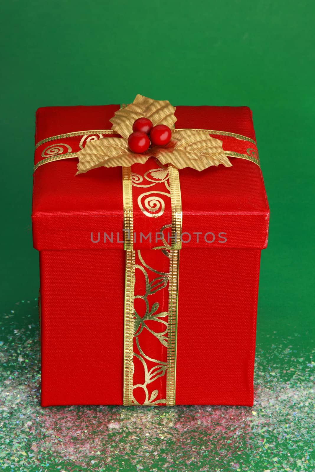 red christmas gift box, green background
