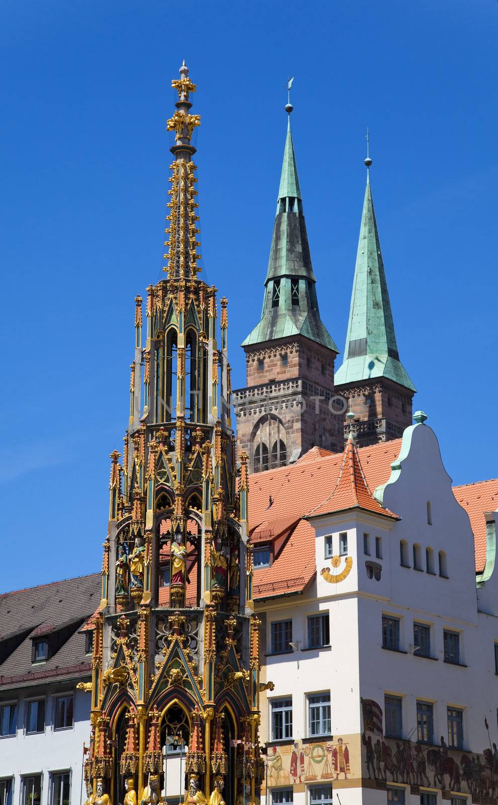 Schöner Brunnen (Beautiful Fountain) and St. Sebaldus Church in Nuremberg (Nürnberg), Germany.