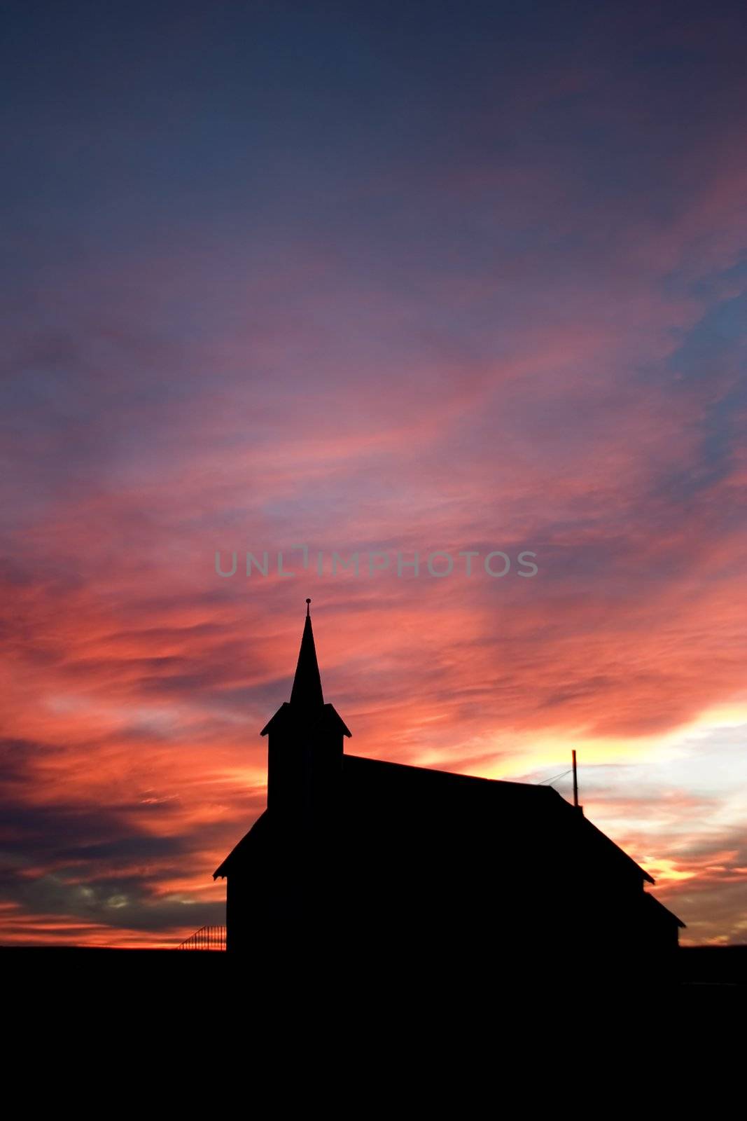 Church on the prairie landscape during sunset