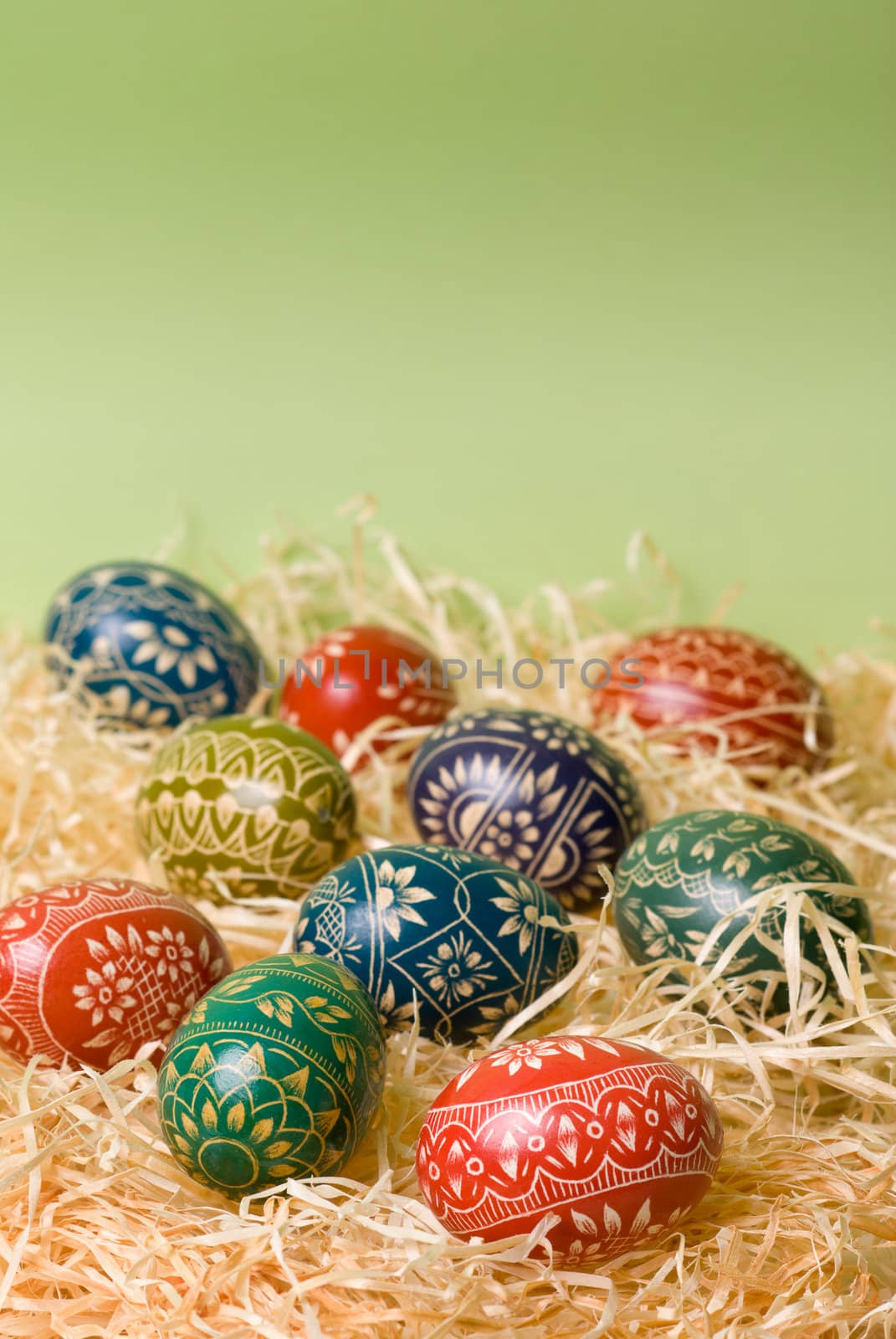 Handmade easter eggs on the shavings. Selective focus, shallow depth of field.