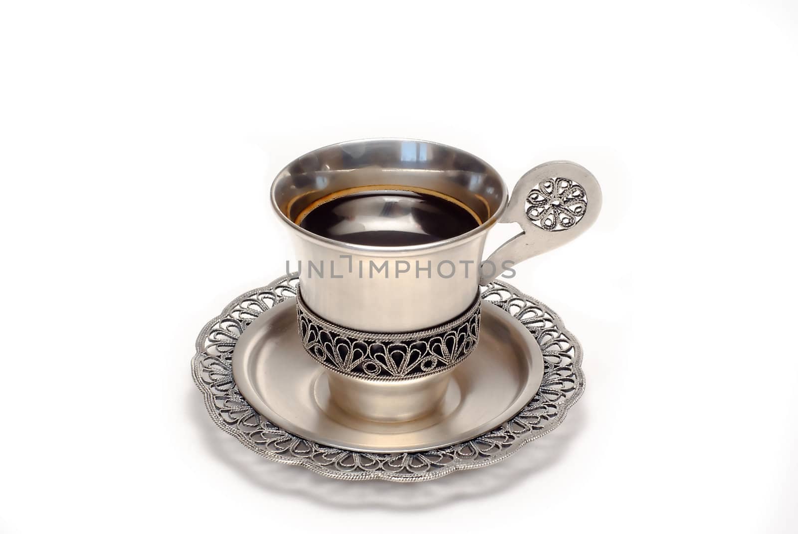 Silver cup of coffee is on the white background