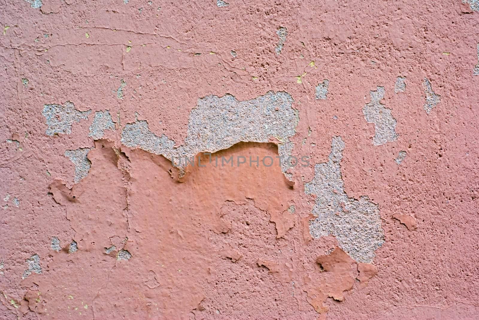 Peeling paint on the wall plastering.