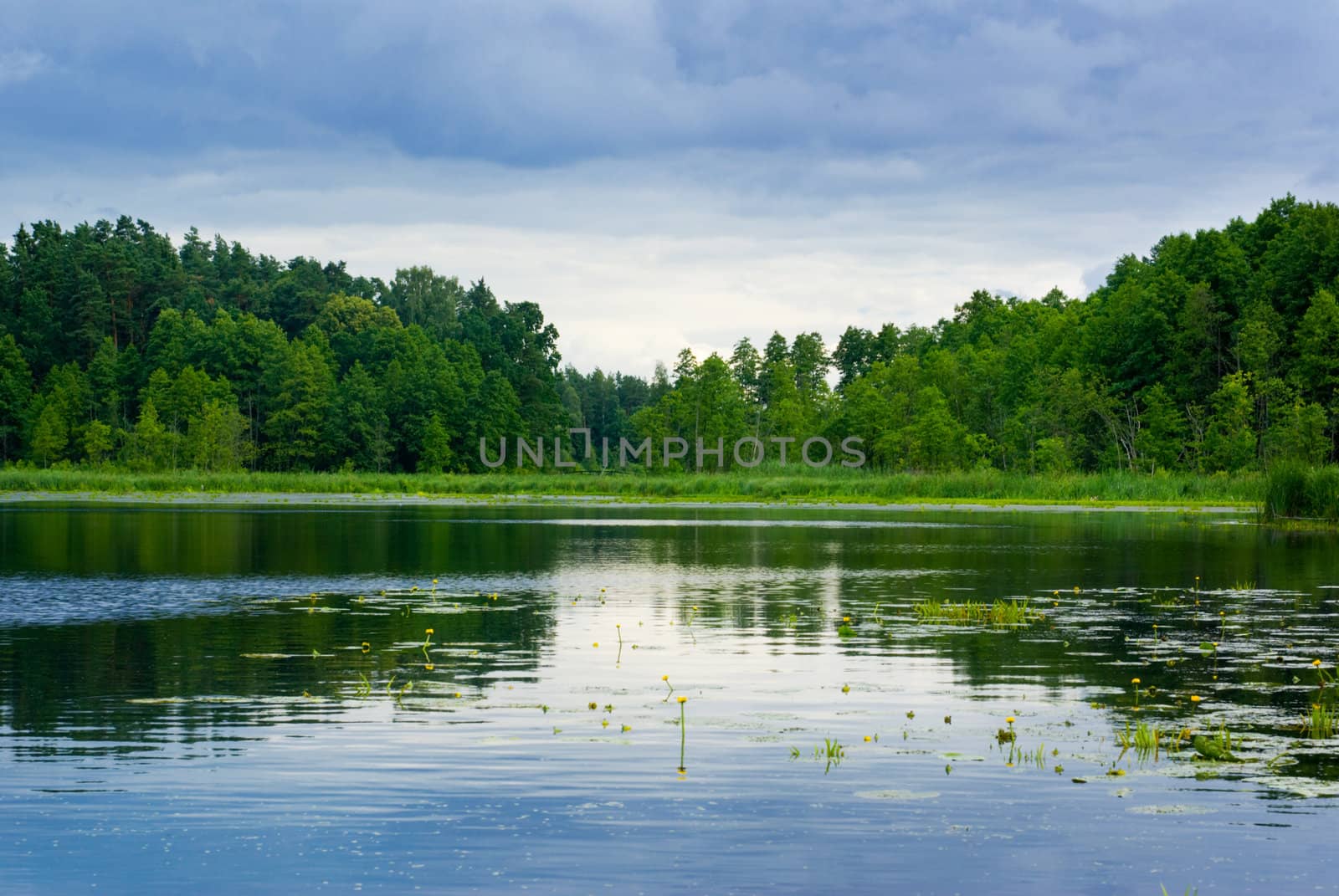 Peaceful lake view - bright interval between rain. Mazury, Poland.