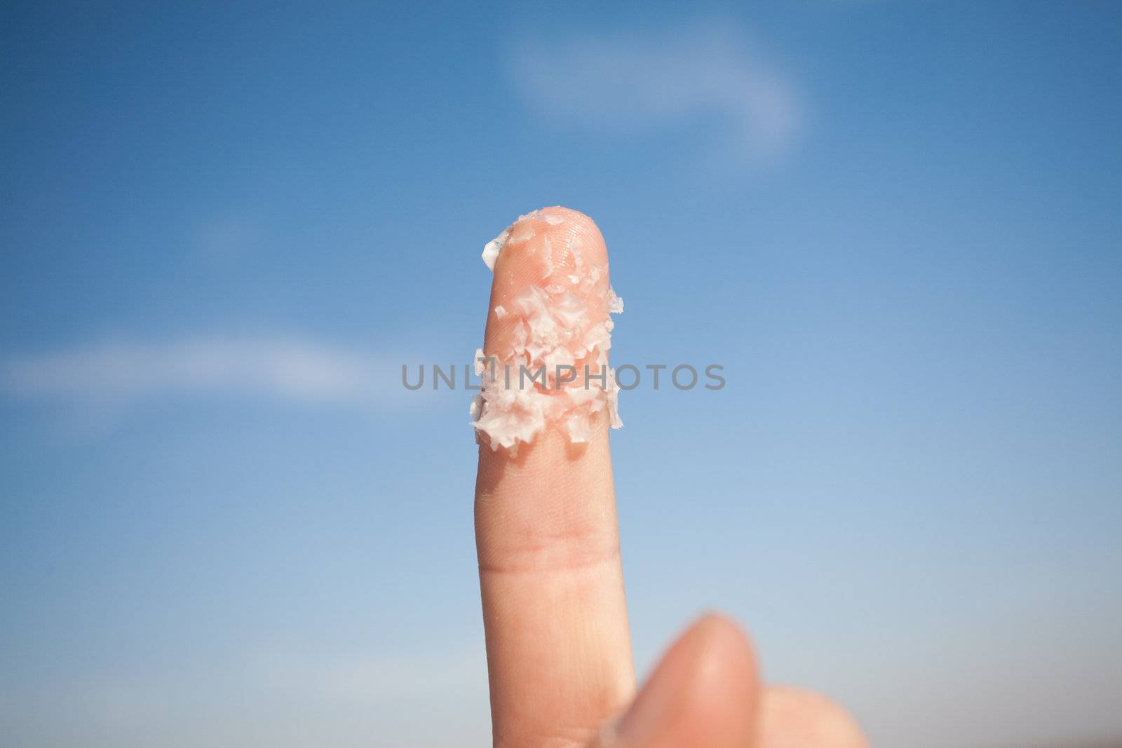 big salt crystals on the finger