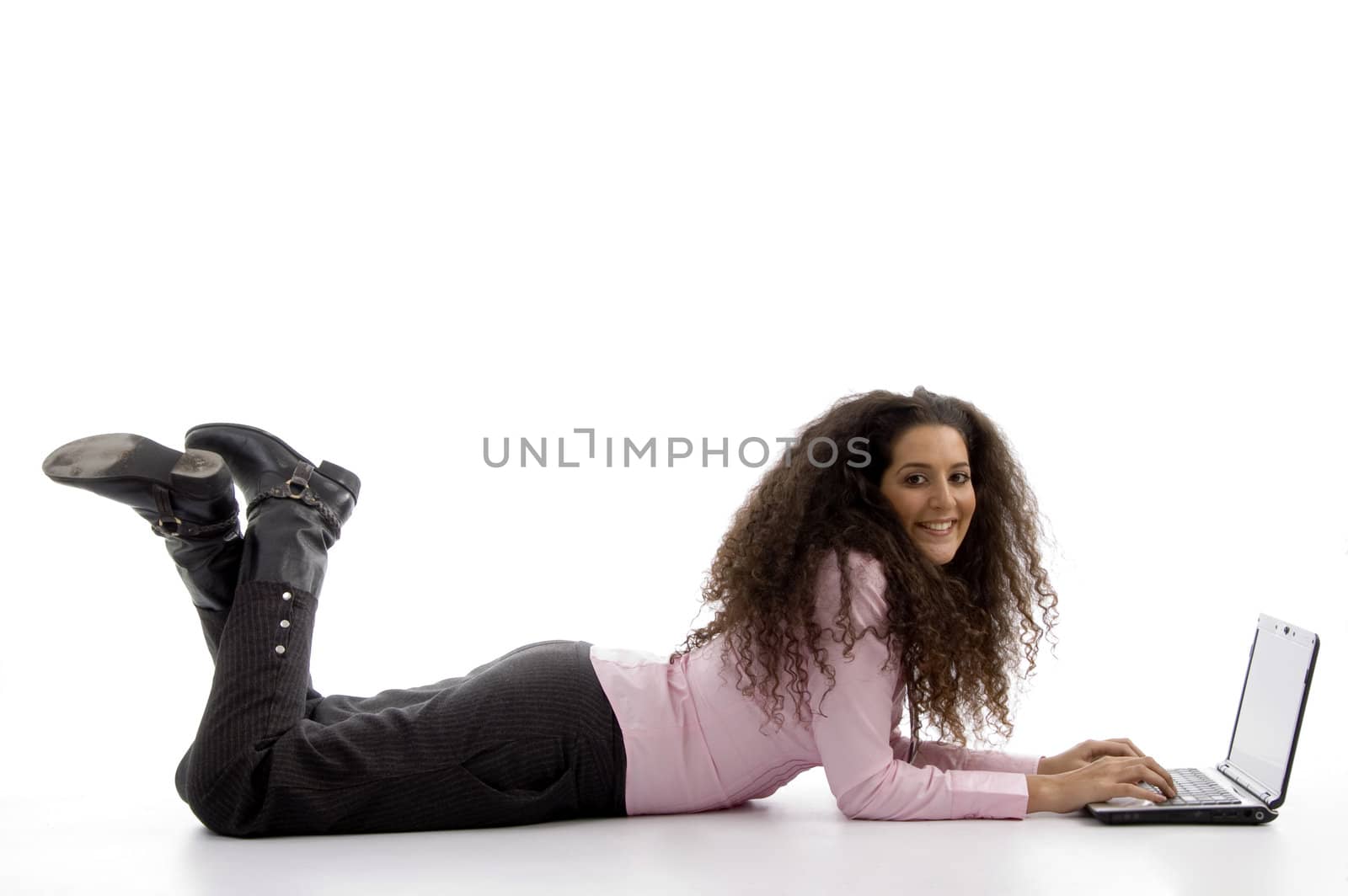 young hispanic female busy working on laptop on an isolated background