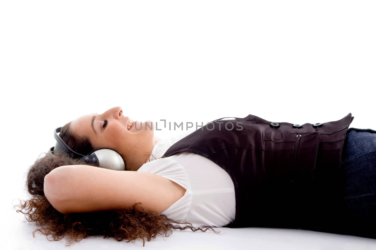 female tuned into music against white background