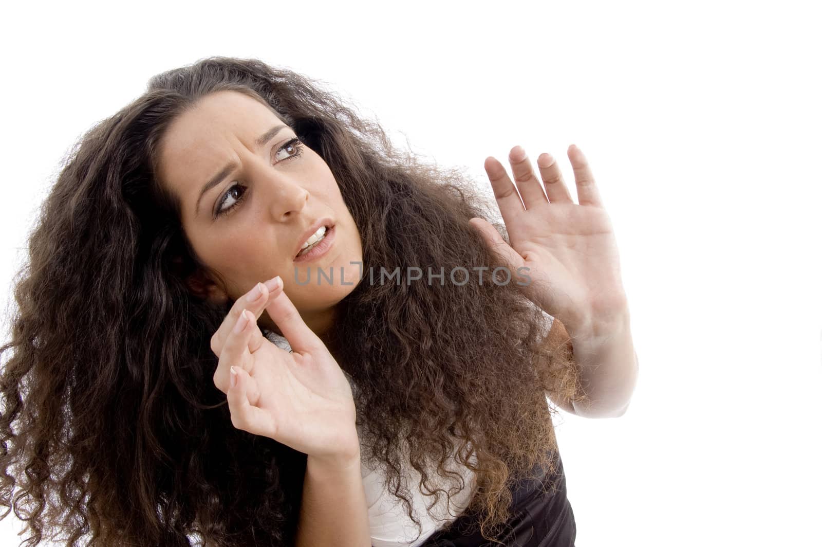 latin american female surprised after looking upwards on an isolated white background