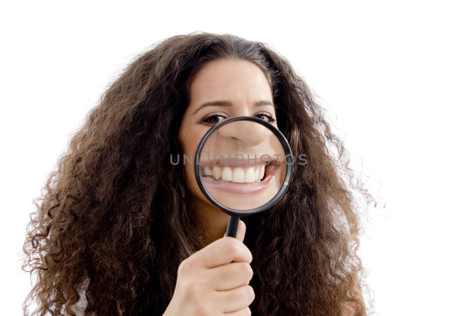 funny woman showing her magnified teeth against white background