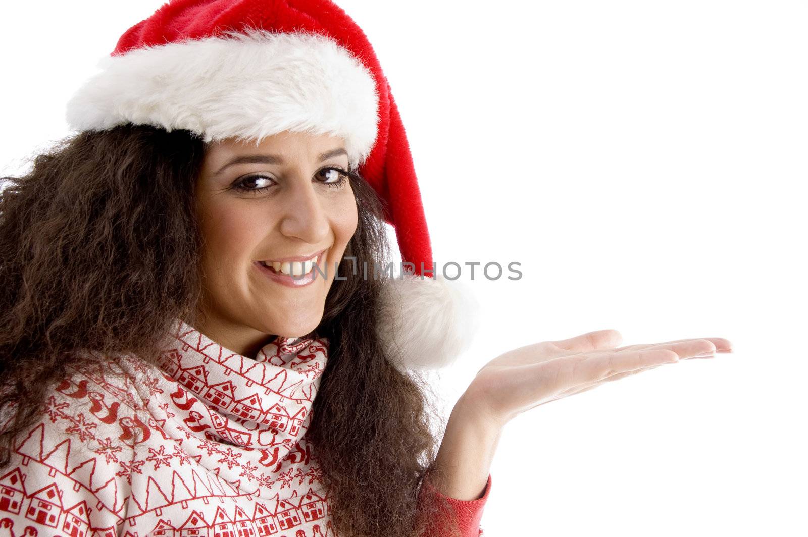 smiling young woman with christmas hat and open palm on an isolated white background