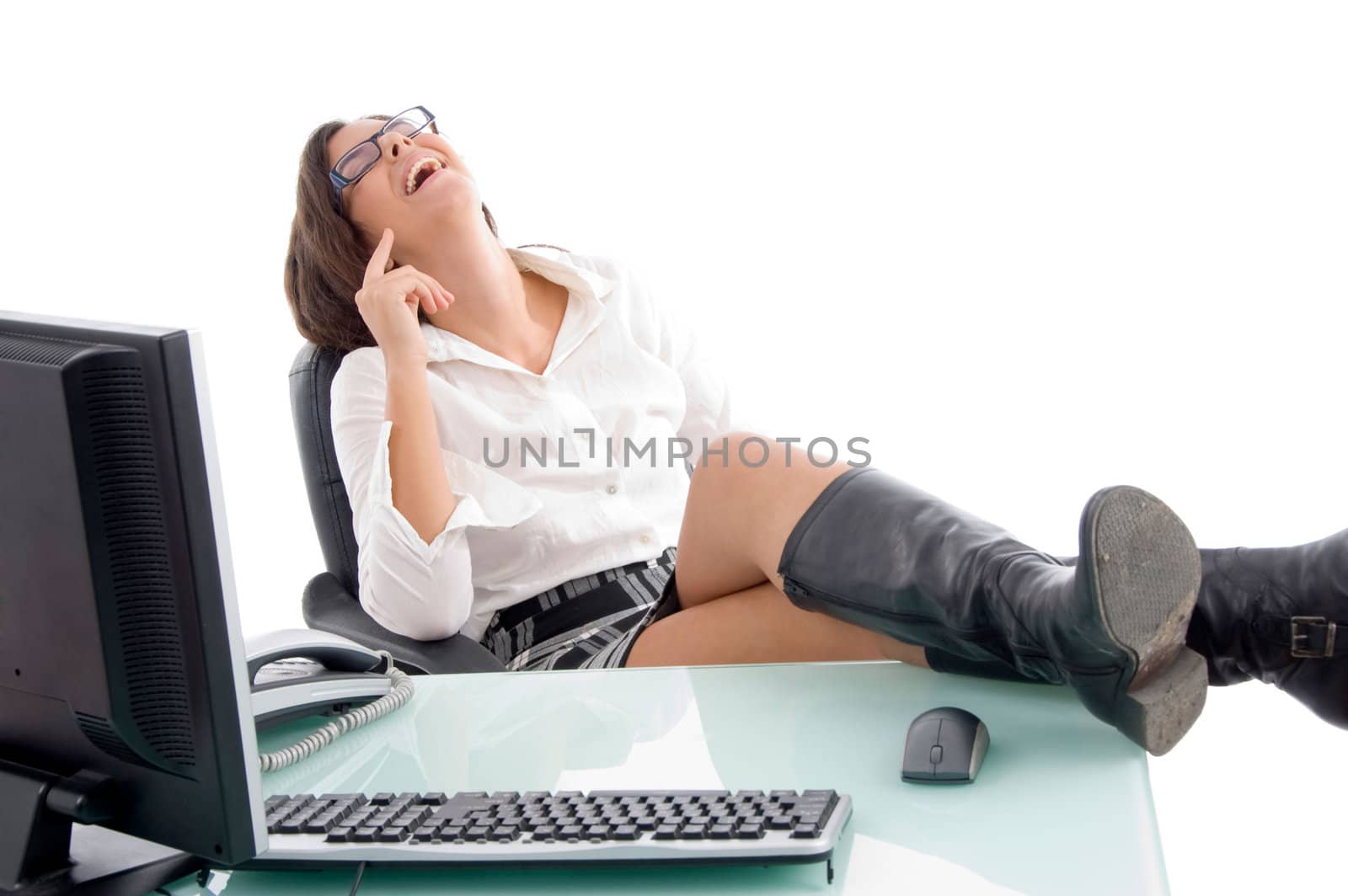 pleased woman sitting in office with white background