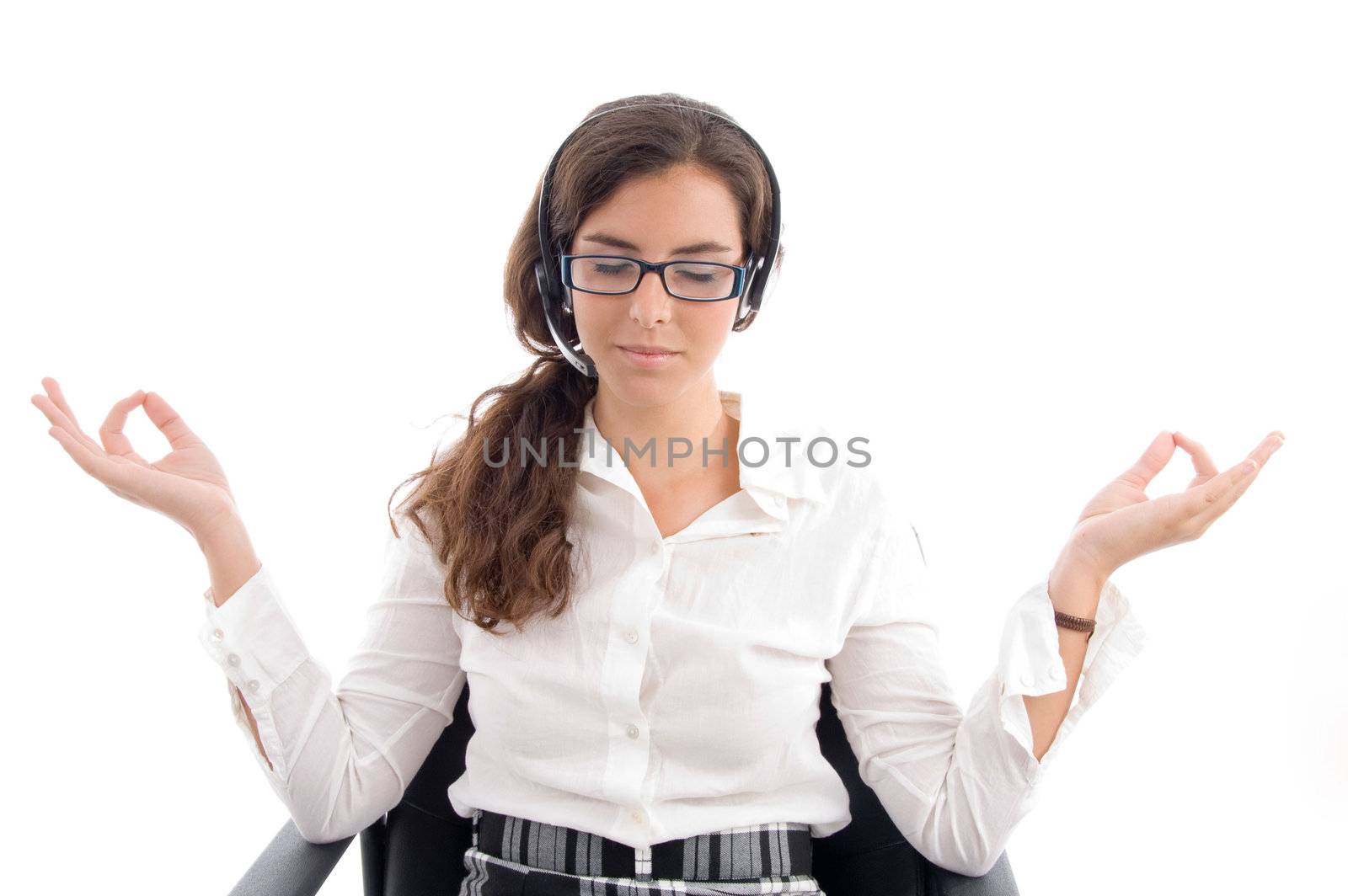 pretty woman doing meditation against white background