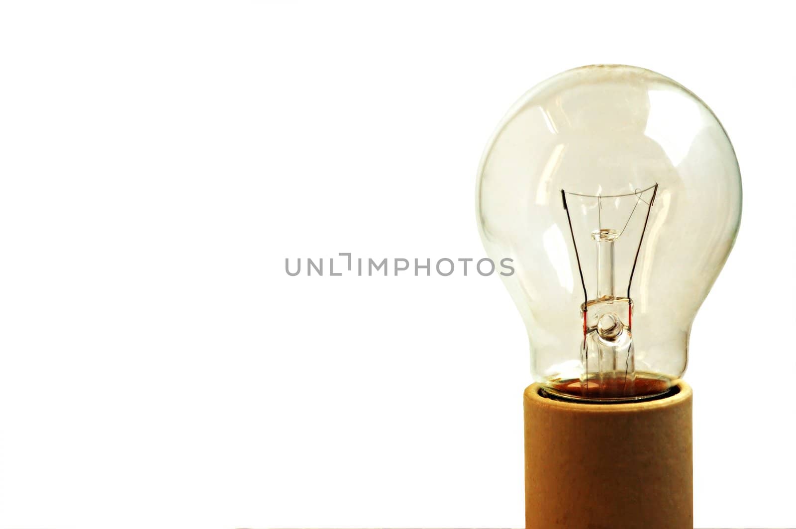 Old light bulb on a socket isolated by nihues