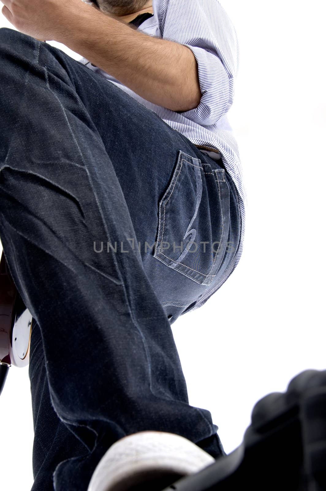 young male shot from low angle against white background