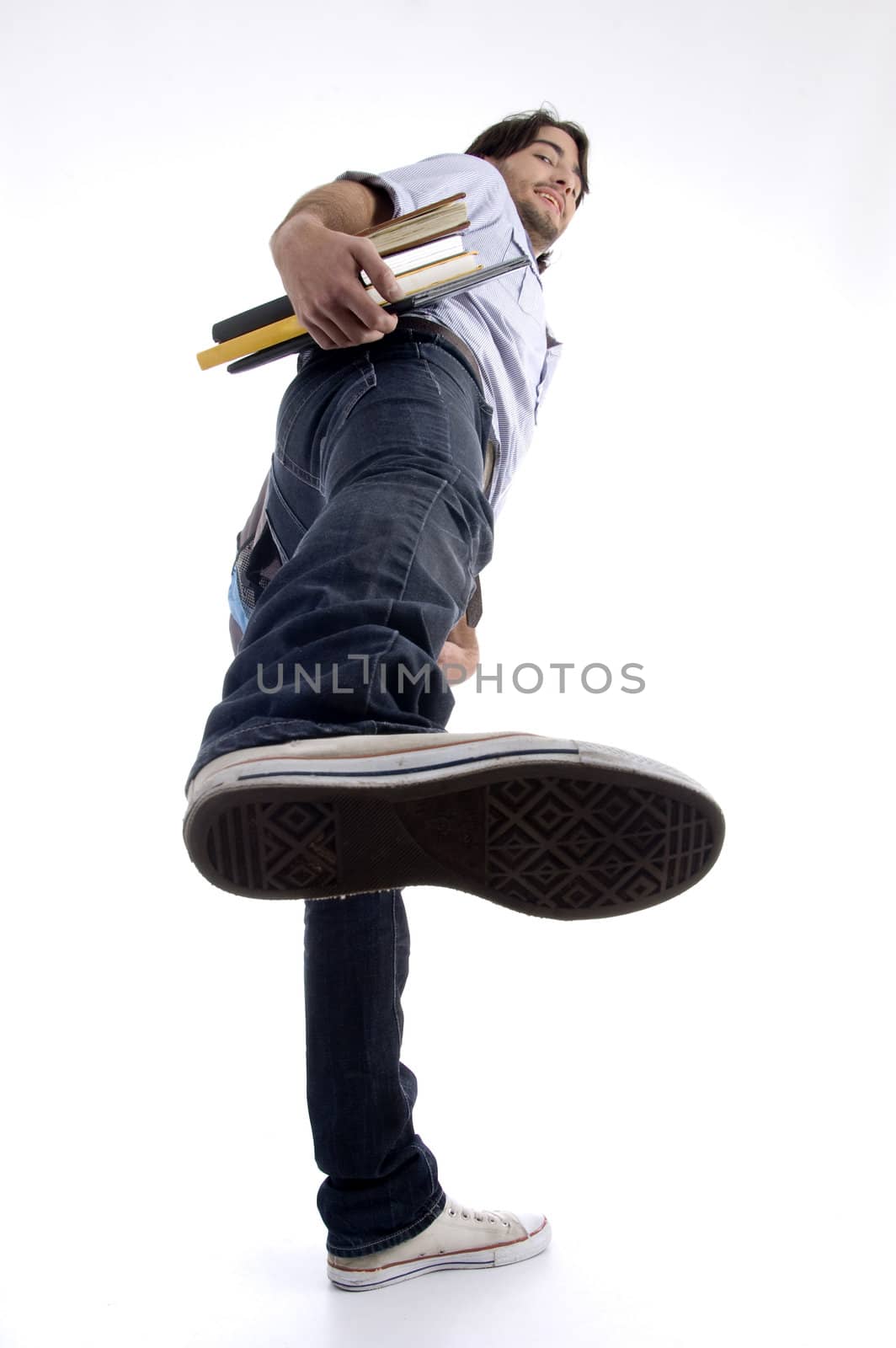 student showing shoe sole on an isolated white background