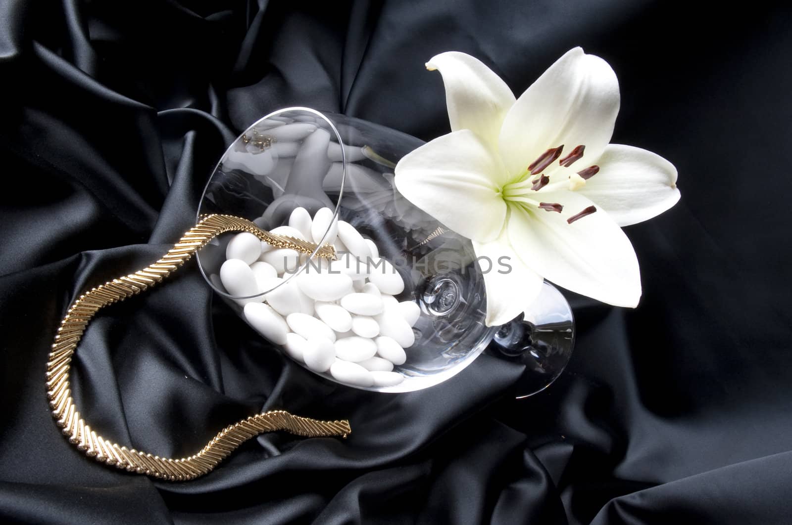 Jewelry and other precious stones on black background fabric