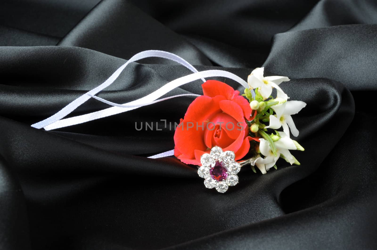 Jewelry and other precious stones on black background fabric
