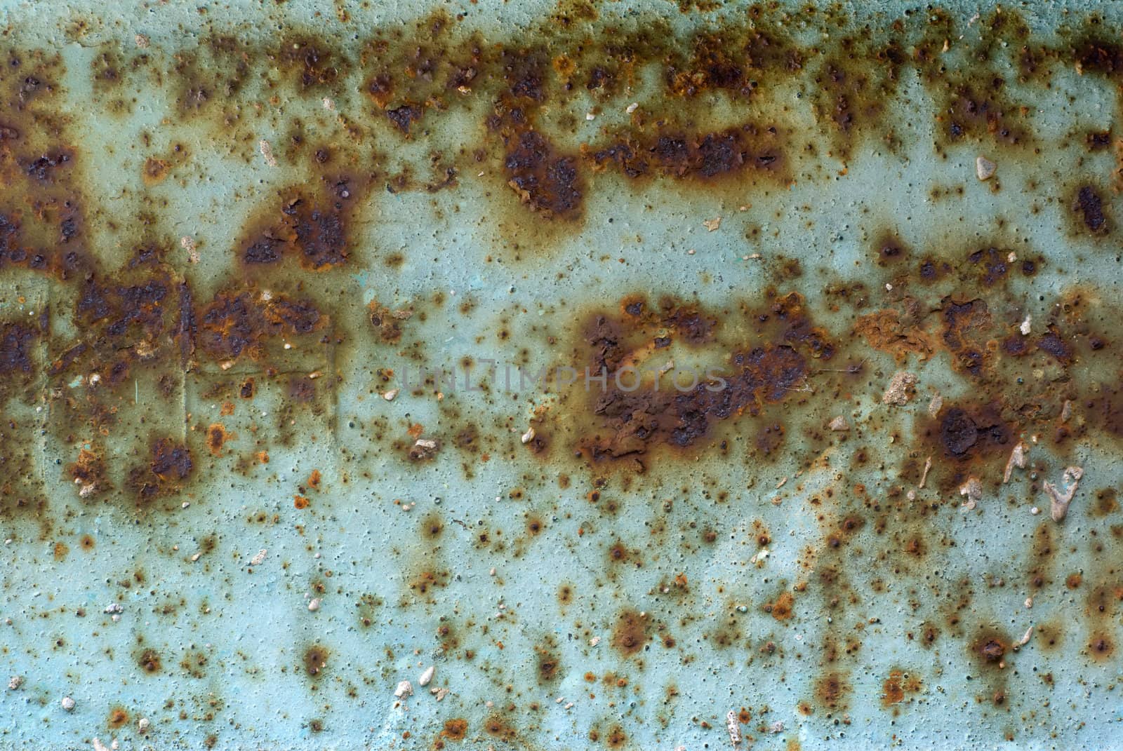 Peeled paint and stains on rusty metal.