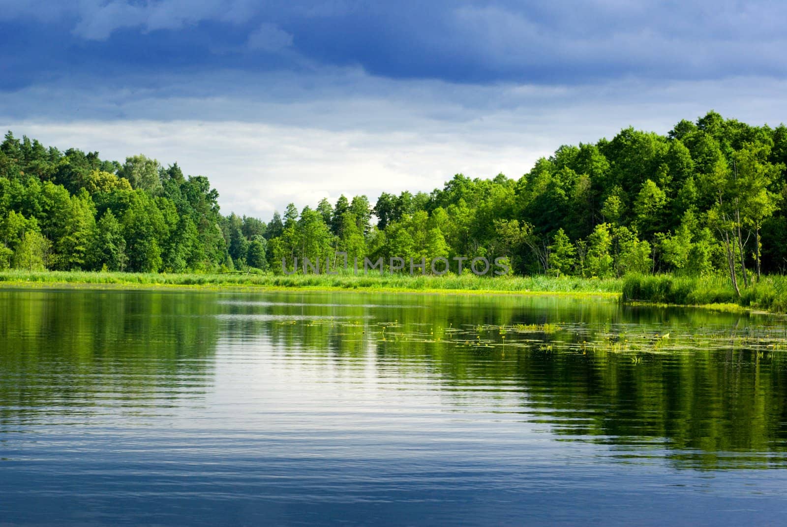 Beautiful lake view - bright interval between rain. Mazury, Poland.