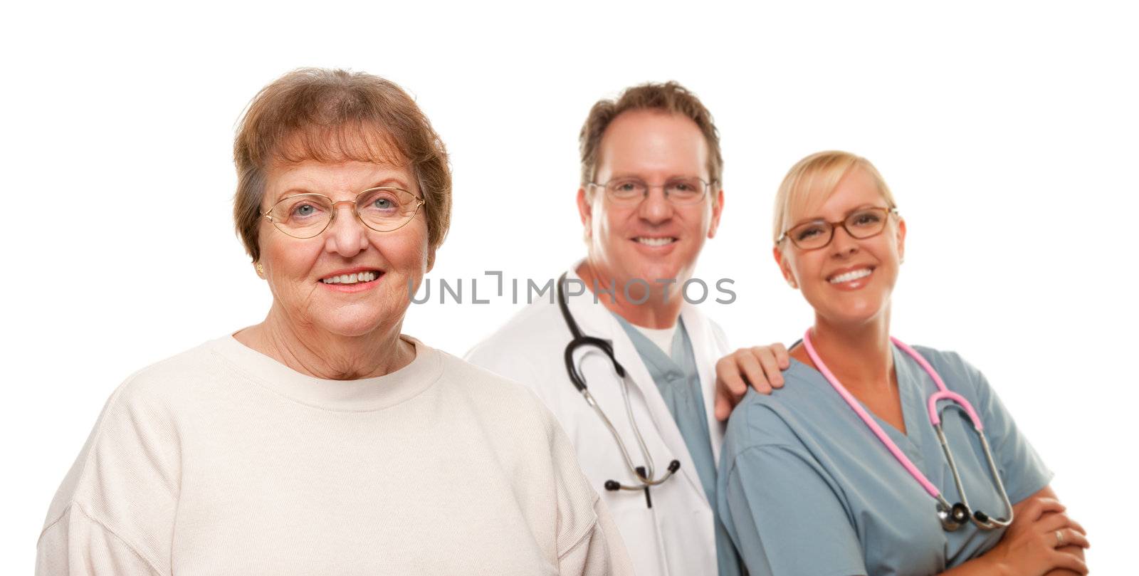 Smiling Senior Woman with Medical Doctor and Nurse Behind Isolated on a White Background.