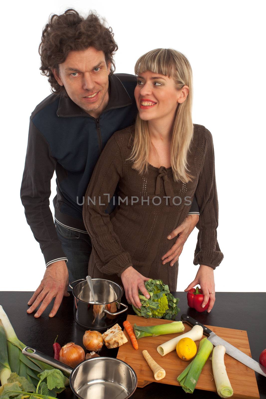 happy couple cooking insolated on white