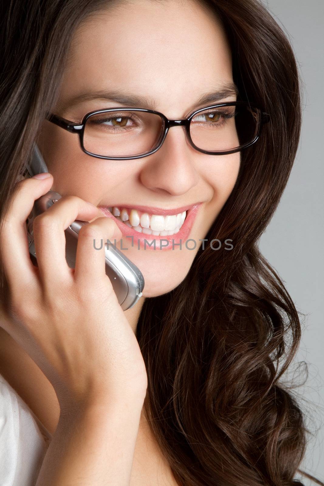 Beautiful smiling girl on phone