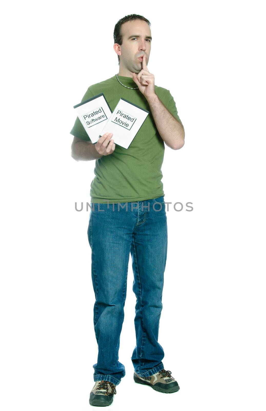 Full length view of a young man holding 2 dvd cases of bootlegged movies and software, isolated against a white background.