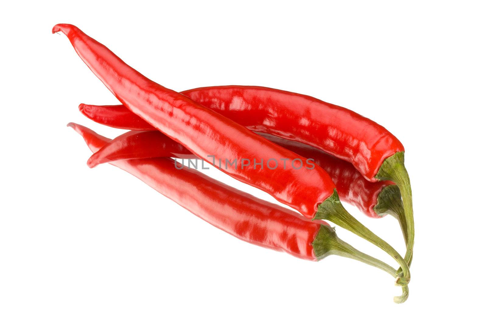 two red peppers on a mirror isolated on a white background