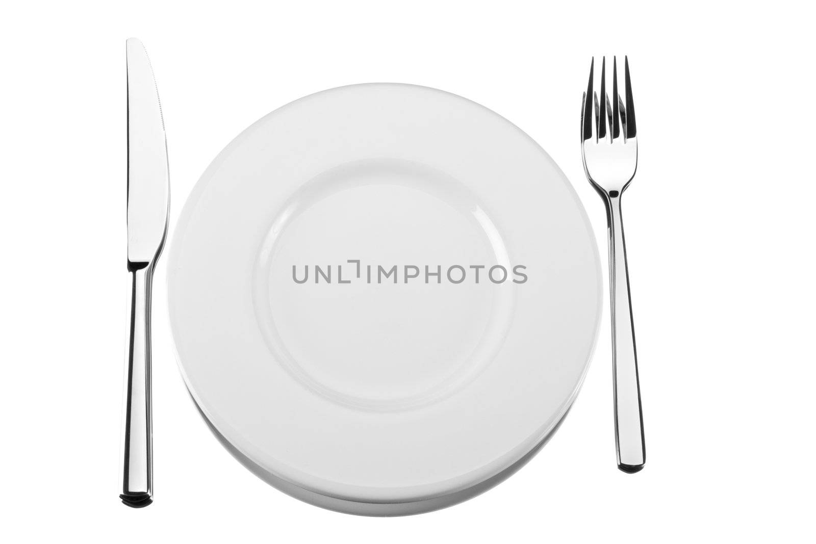 fork, knife and a spoon on a white plate by bernjuer