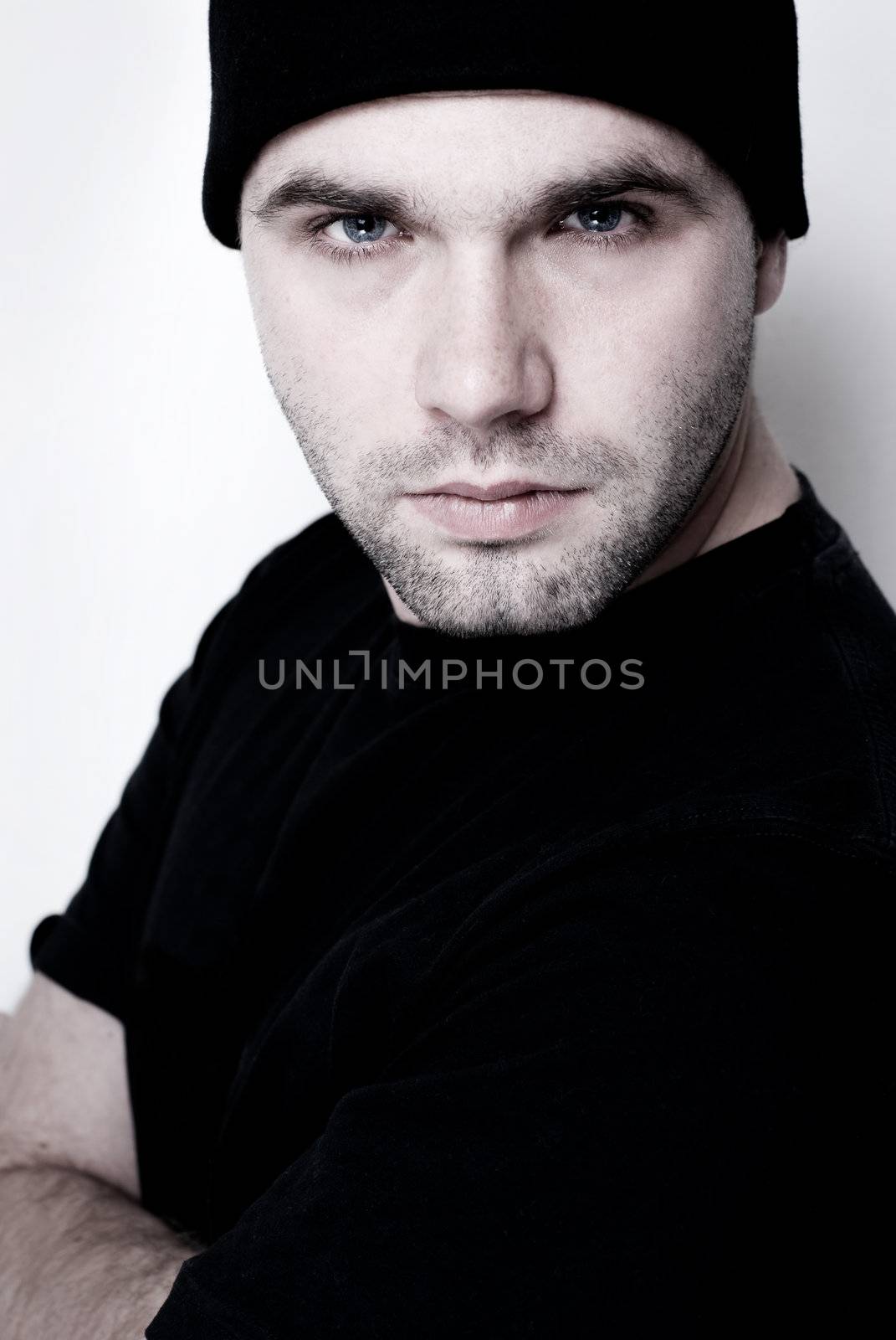 Portrait of young man wearing beanie - selective focus on the eyes.