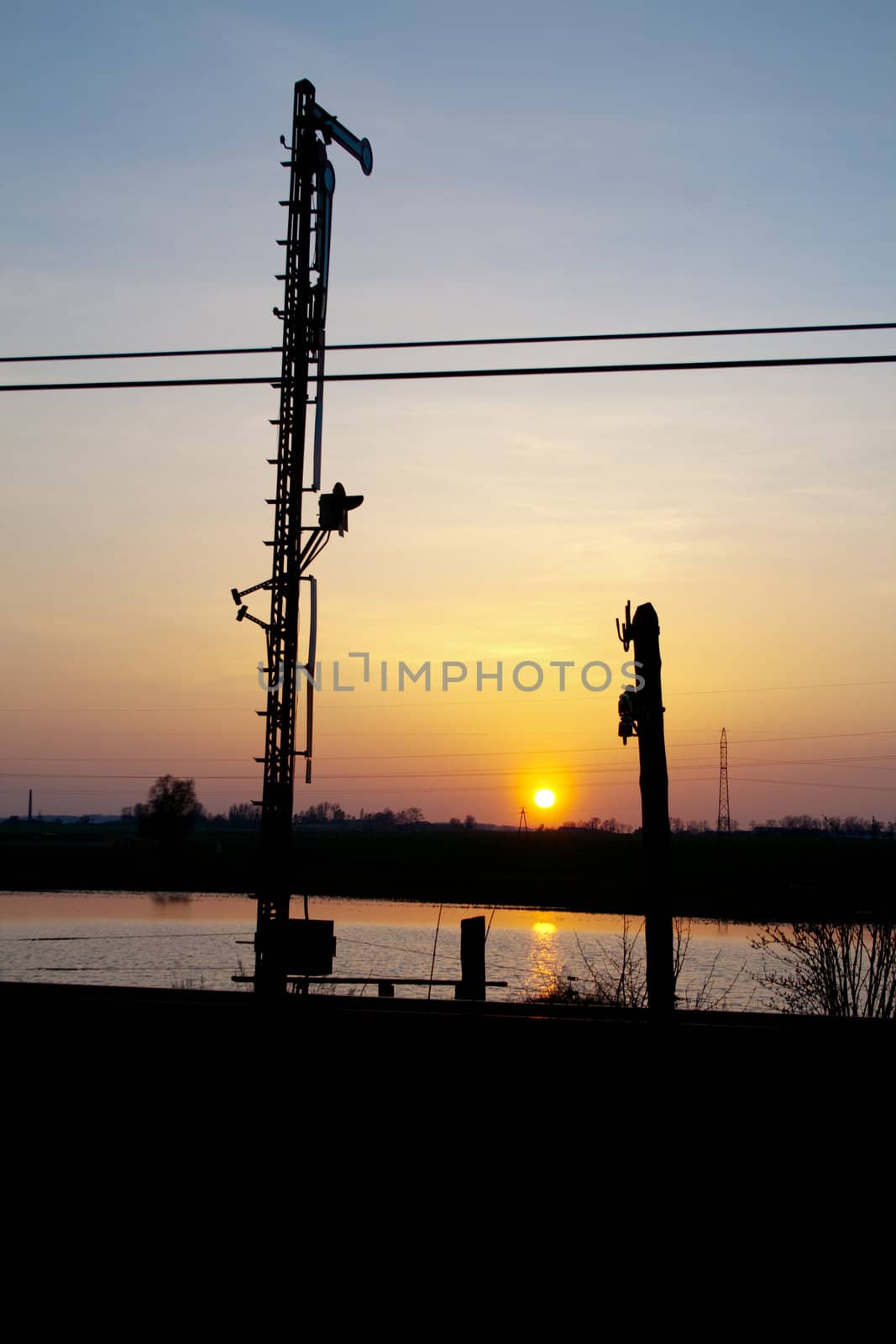Railway semaphore silhouette during the sunset
