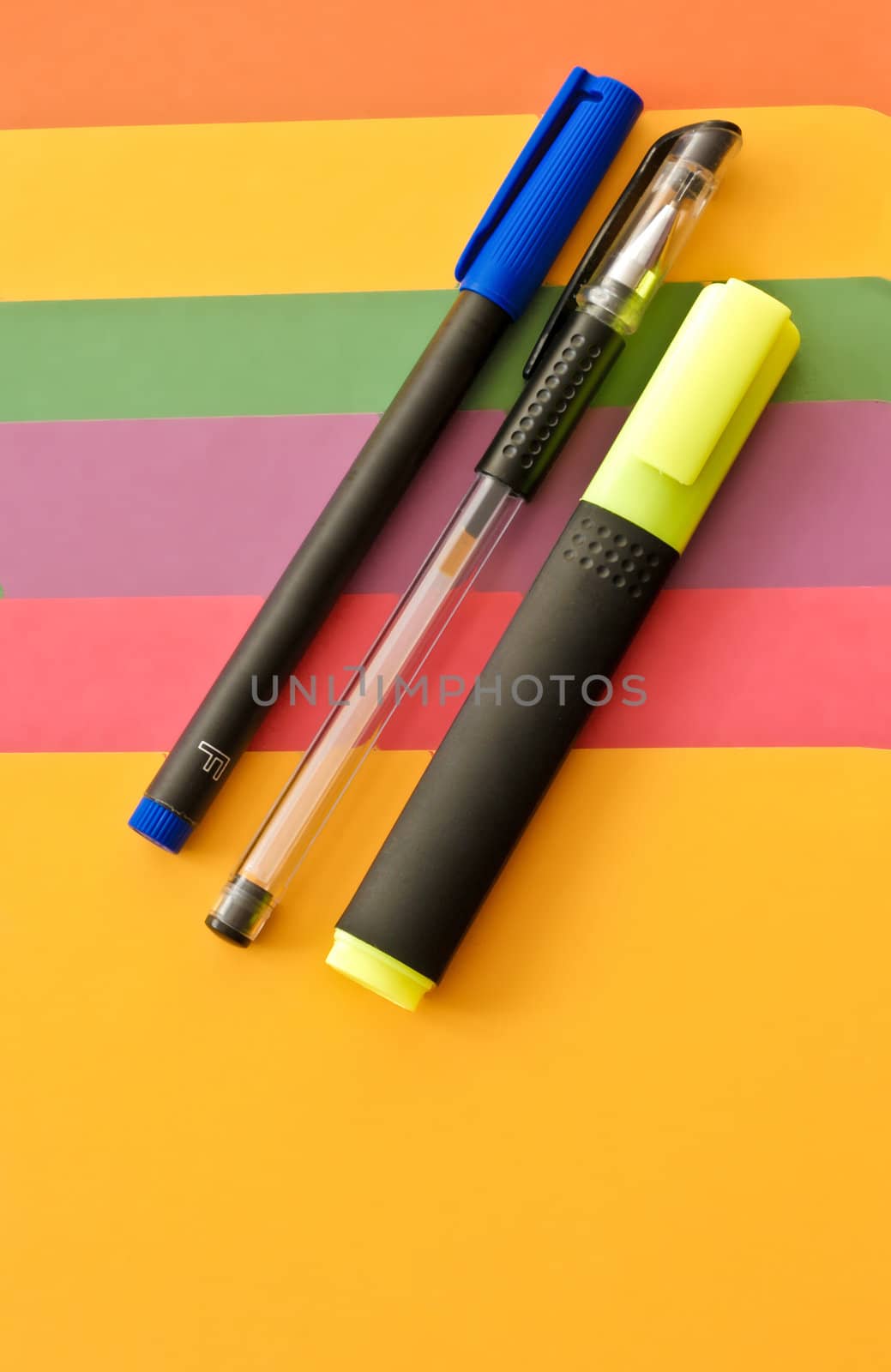 Highlight pens on a colorful background
