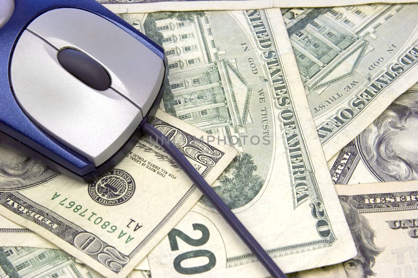 Computer mouse on money