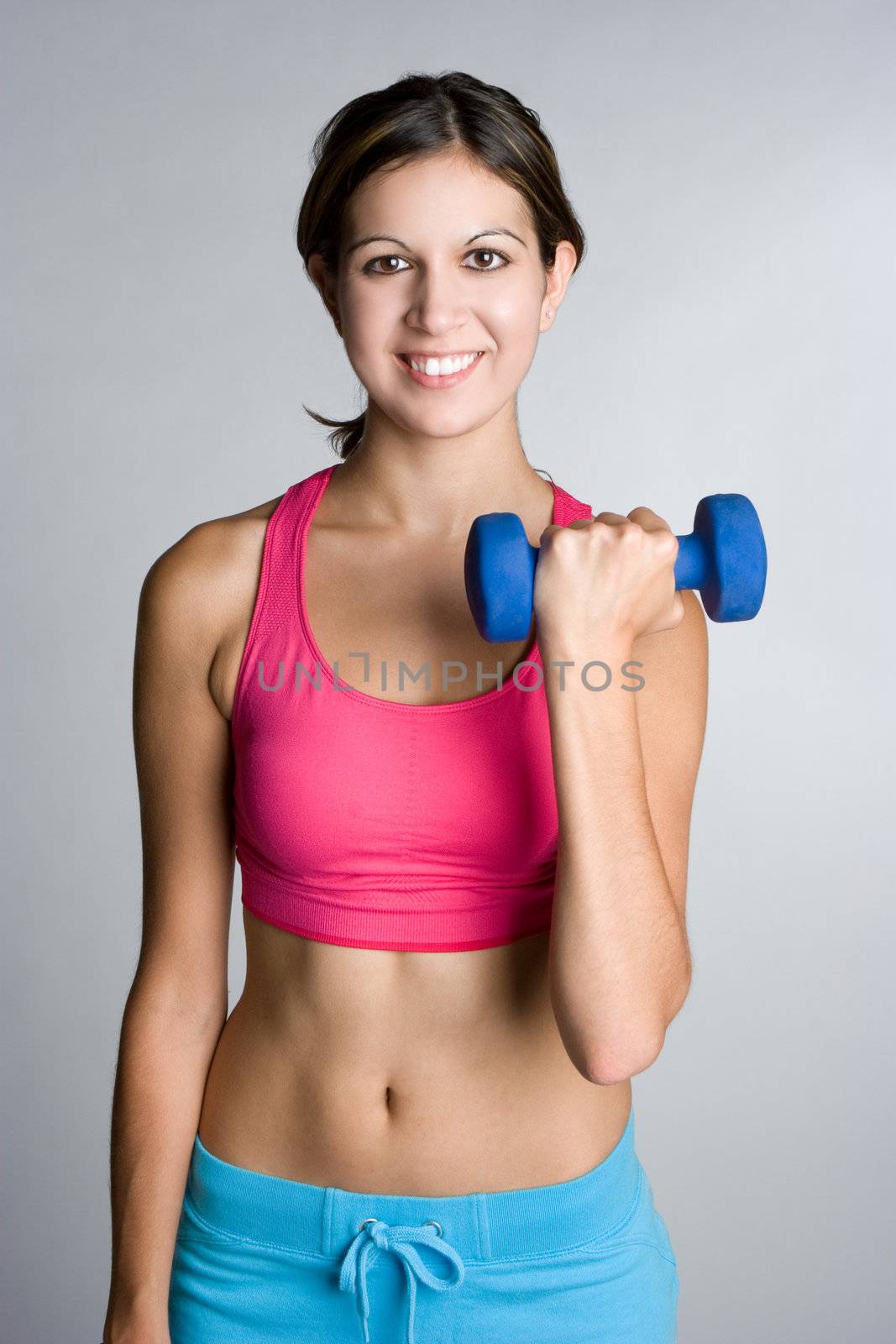 Fitness girl lifting dumbbells