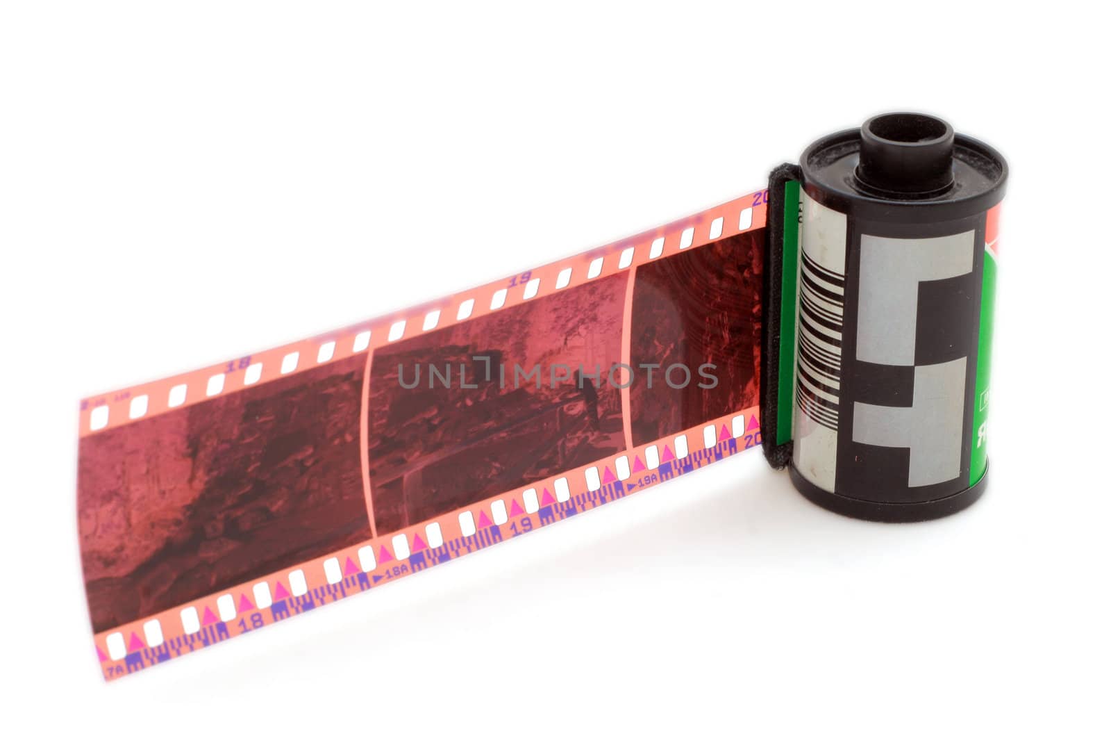 35 mm negative film and roll isolated in white background